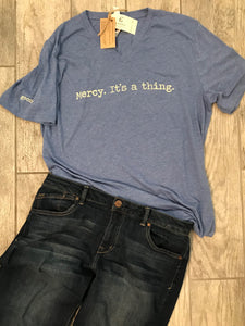 "Mercy. It's a thing." Short Sleeve Tee Shirt, V-Neck, Heather Blue Tri-Blend