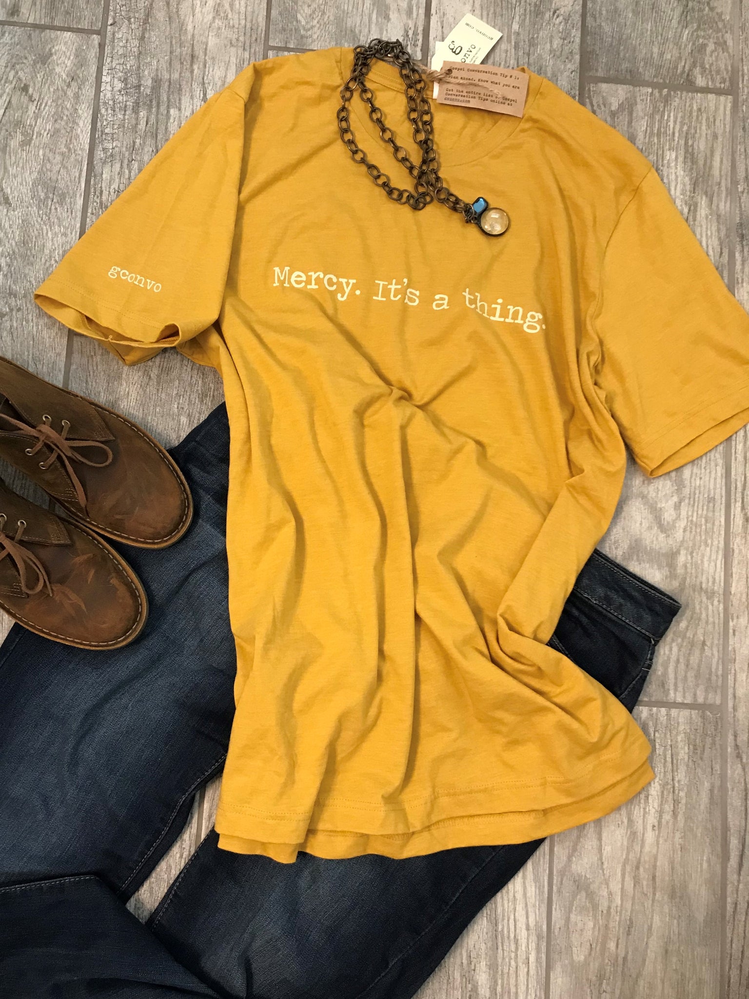 "Mercy. It's a thing." Short Sleeve Tee Shirt, Crew Neck, Heather Mustard